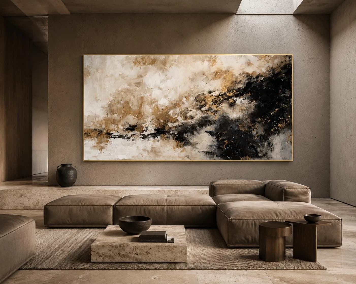 A calm, stone-walled living space with a large abstract painting in black, white and gold